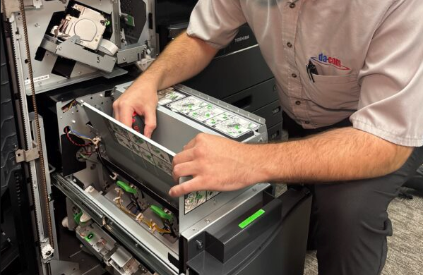Service tech working on an office MFP